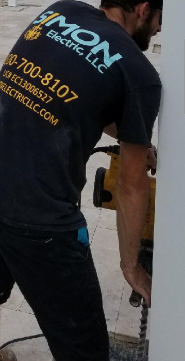 Drililng Holes & Running Conduit to Power Lighting & Fans in Delray Beach, FL